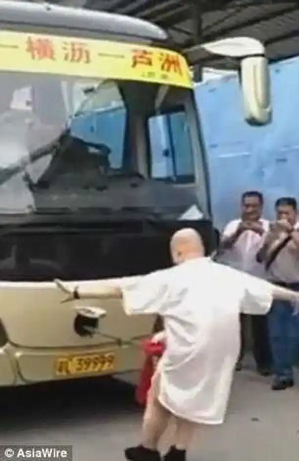 Unbelievable A Chinese Man Pulls A Bus With A Rope Attached To His P*nis {See Photos}
